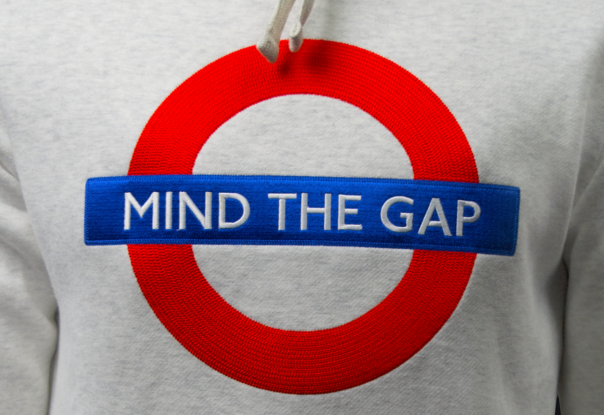 TFL129MTG ASH Licensed Unisex Mind the Gap Applique Embroidery Ash Grey